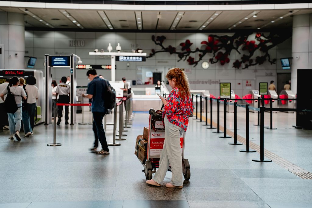 woman using phone in an airport