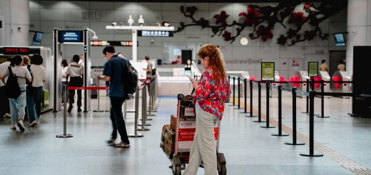 woman using phone in an airport