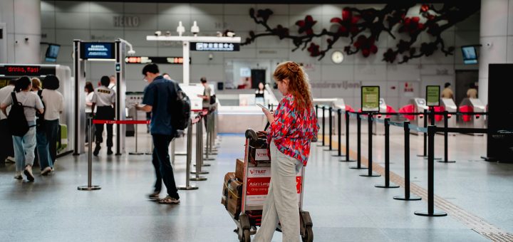 woman using phone in an airport