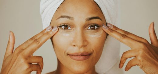a woman applying moisturiser
