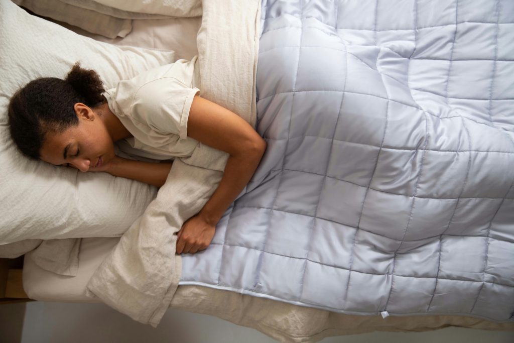 woman sleeping with weighted blanket