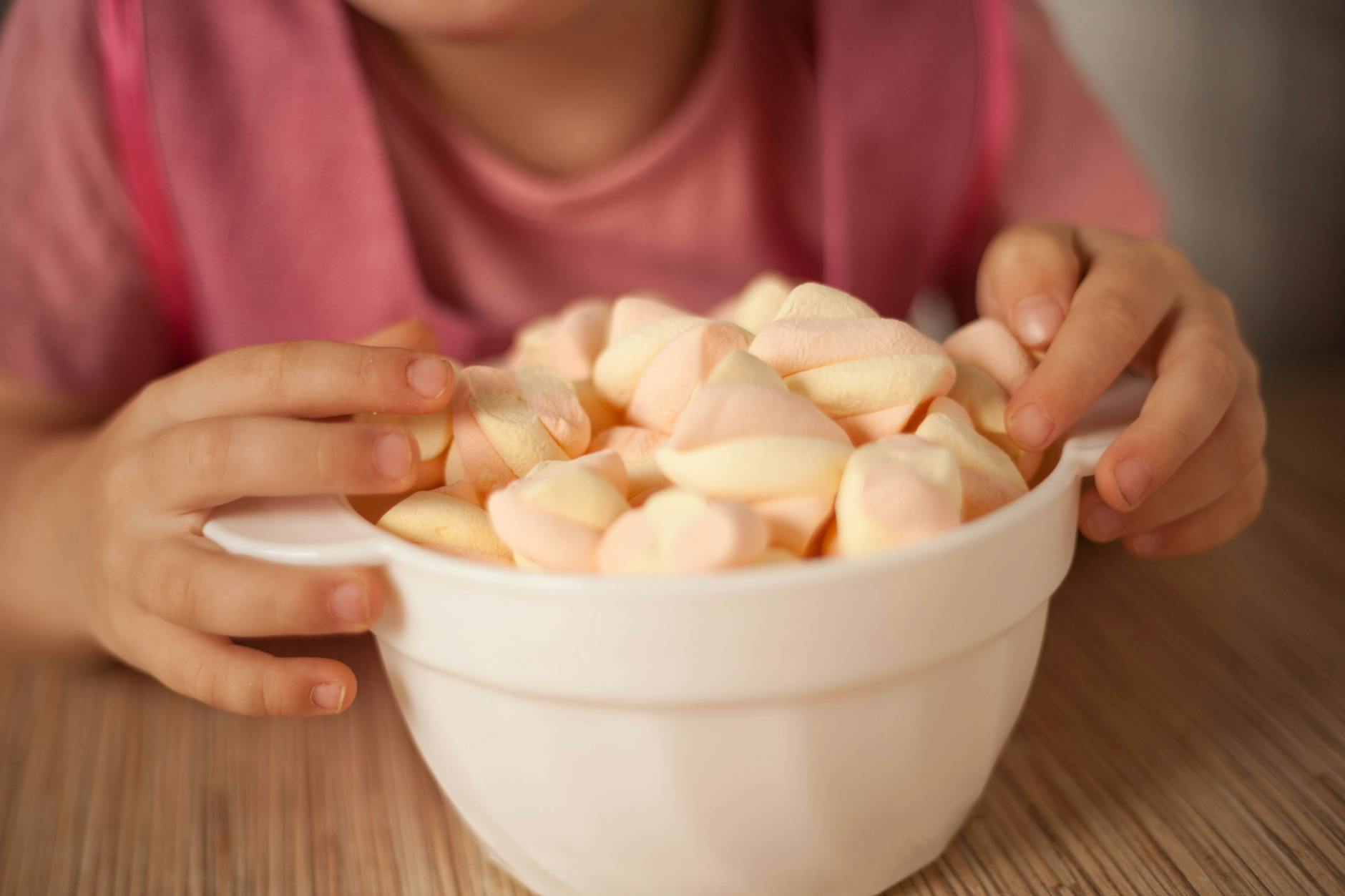 a close up shot of a bowl of marshmallows