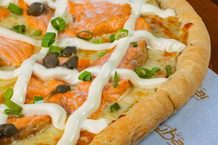 gourmet salmon and cream pizza close up