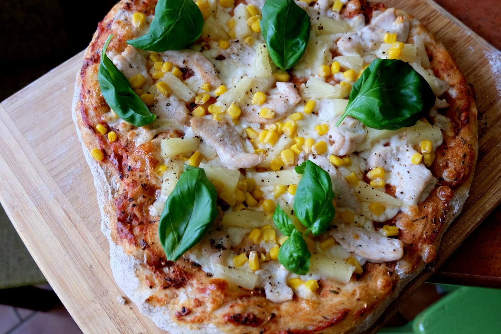 homemade chicken pineapple pizza with basil