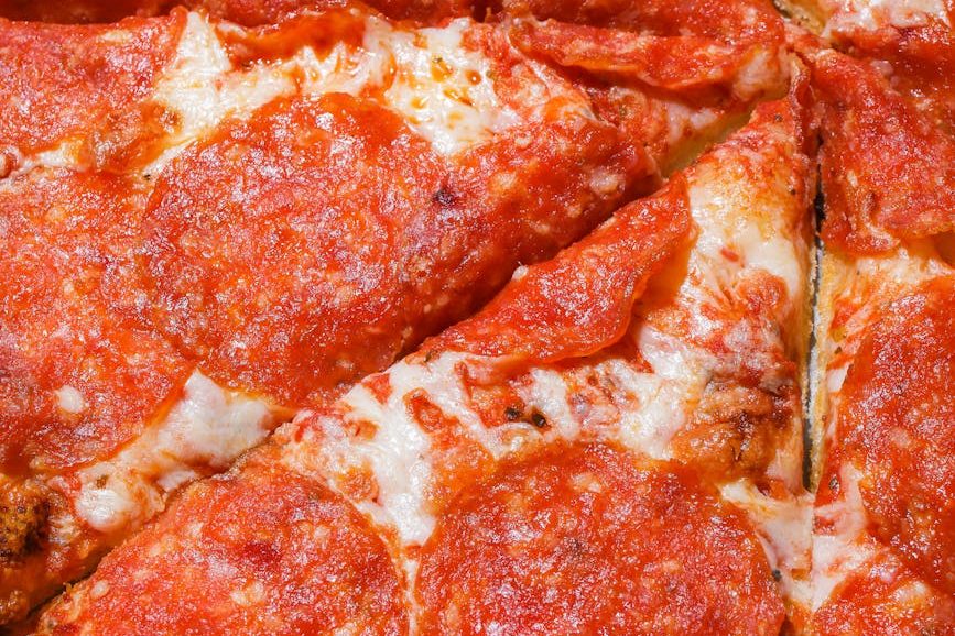 sliced pepperoni pizza in close up view